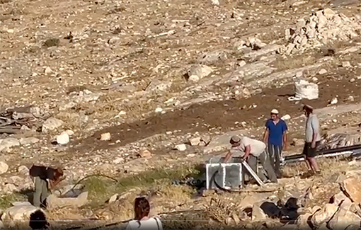 Thumbnail preview image for the video titled: Settlers with guns destroy the pump that provides water for the village of Khirbet Umm Al-Khair in Hebron