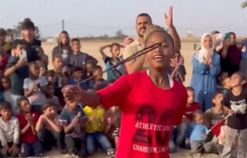 Thumbnail preview image for the video titled: Displaced children in Gaza dance dabke and smile together, an act of joy, tradition, and resistance to the genocide