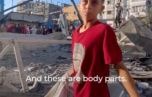 Thumbnail preview image for the video titled: Palestinian boy collects human body parts in a carrier bag after an Israeli attack