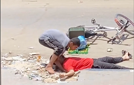 Thumbnail preview image for the video titled: Young Palestinians brave danger to pull the body of a civilian sniped by IDF