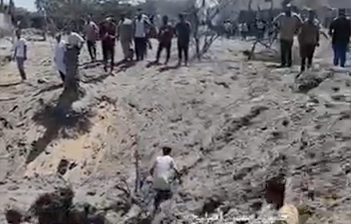 Thumbnail preview image for the video titled: People buried in large crater left by IDF massacre in Al-Mawasi