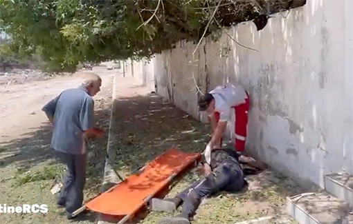 Thumbnail preview image for the video titled: Palestinian Red Crescent teams provide first aid to injured man before transferring him to Al-Ahli Baptist Hospital