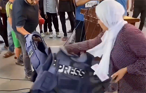 Thumbnail preview image for the video titled: Gaza journalists remove their vests protesting their murder by IDF