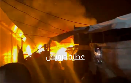 Thumbnail preview image for the video titled: Attempt to extinguish fire after IDF struck IDP tents in hospital courtyard