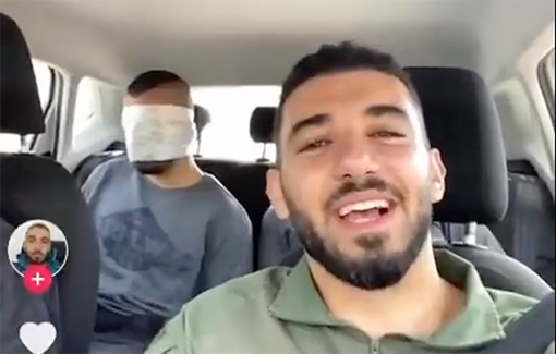 Thumbnail preview image for the video titled: Blindfolded prisoners in a car, singing and laughing