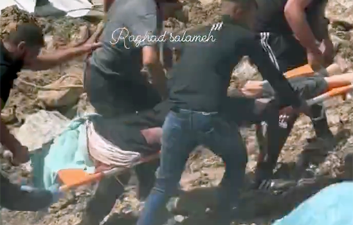 Thumbnail preview image for the video titled: Carrying a body from the rubble of a house Israel bombed to an ambulance