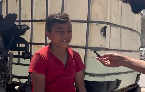 Thumbnail preview image for the video titled: Mustafa, age 12, who lost his both his legs when Israel bombed his home, sells water hoping to buy artifical legs