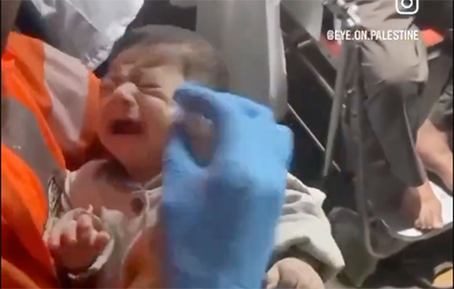 Thumbnail preview image for the video titled: Baby being cared for in a medical tent during the Rafah ground offensive