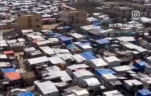 Thumbnail preview image for the video titled: Aerial view of a tent city of displaced people in Deir Al Balah