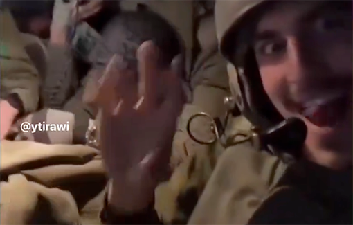 Thumbnail preview image for the video titled: IDF soldiers in an armored vehicle cheering while blowing up homes in Rafah