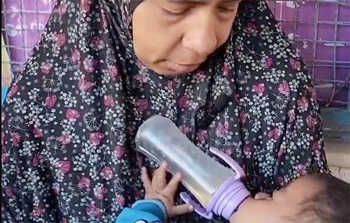 Thumbnail preview image for the video titled: Mother in Rafah is only able to feed her baby milk from lentils