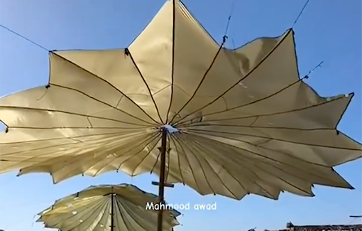 Thumbnail preview image for the video titled: Resourceful Palestinians reuse the aid parachutes that litter Gaza to create shade to protect themselves from the summer heat