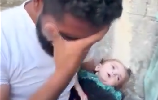 Thumbnail preview image for the video titled: A father in Gaza has an emotional breakdown while holding his daughter, who Israel is starving to death