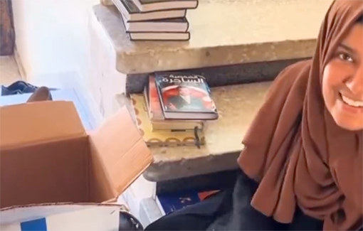 Thumbnail preview image for the video titled: A mother in Gaza is overcome by joy when she discovers that her book collection survived Israel's destruction of her home