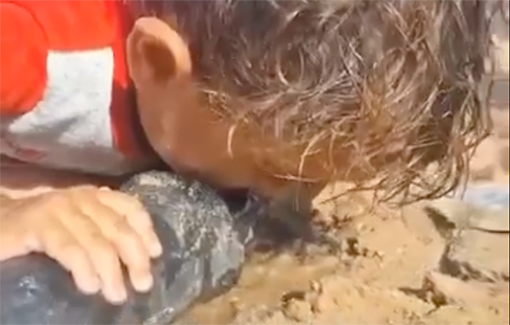 Thumbnail preview image for the video titled: A child, suffering from the brutal Israeli siege against the people of Gaza, is overjoyed to have a sip of water from a hole in a PVC pipe