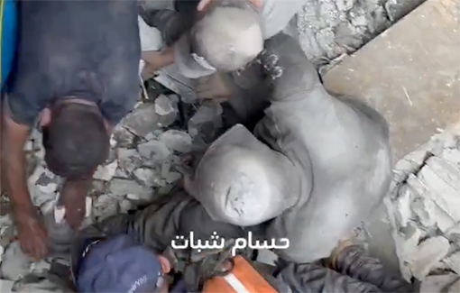 Thumbnail preview image for the video titled: Searching for survivors and dismembered body parts in the Jabalia refugee camp after aerial strike