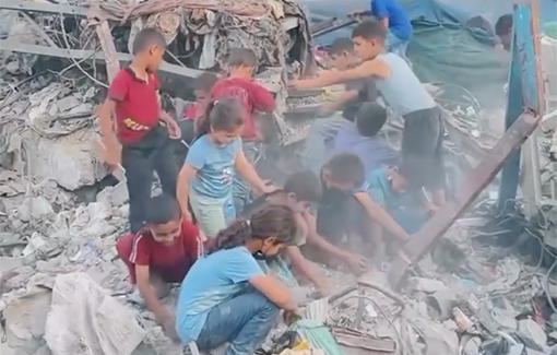 Thumbnail preview image for the video titled: Children search for food at a shelter for IDPs in Gaza City bombed by the IDF