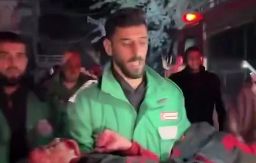 Thumbnail preview image for the video titled: Paramedic carries child killed in Israeli bombing of Abu Jadba family