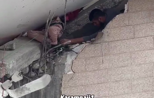 Thumbnail preview image for the video titled: Little girl's body stuck in the rubble of Al-Tabi'in school after Israeli bombing