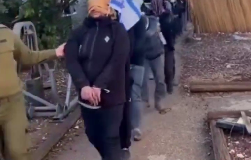 Thumbnail preview image for the video titled: A line of blindfolded, cuffed abductees being forced to march.