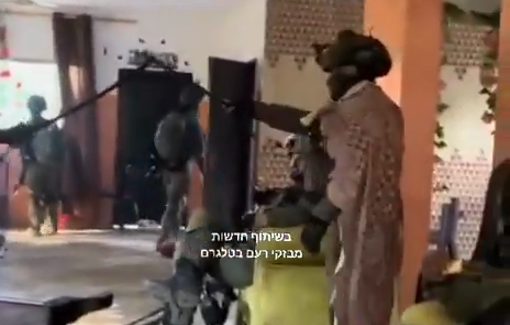 Thumbnail preview image for the video titled: Israeli soldiers play a sword duel in a Palestinian living room