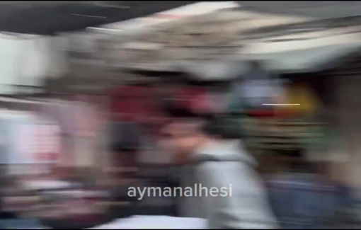 Thumbnail preview image for the video titled: Locals rescue casualties and try to put out fire following Israeli bombing in a market