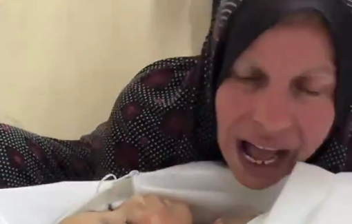 Thumbnail preview image for the video titled: Woman bids farewell to child killed by Israeli drone strike in Nuseirat