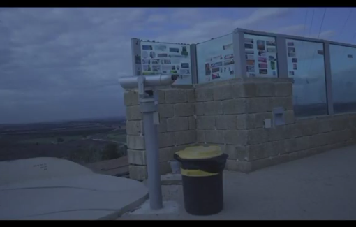 Thumbnail preview image for the video titled: In Sderot Israelis gather each day on fixed "viewing platforms" to watch the ongoing genocide