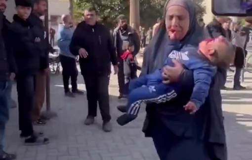 Thumbnail preview image for the video titled: Mother carries wounded infant to hospital following Israeli school bombing