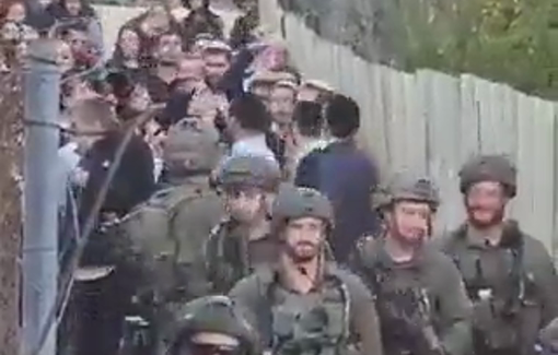 Thumbnail preview image for the video titled: Guarded by heavy-armed soldiers, colonial settlers have raided the Old City of Al-Khalil/Hebron