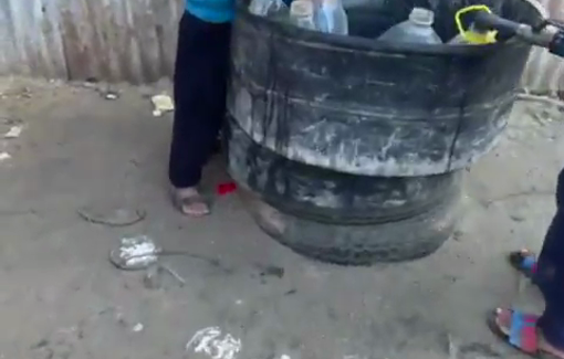 Thumbnail preview image for the video titled: Footage of children collecting water from an unfiltered, highly salinated source