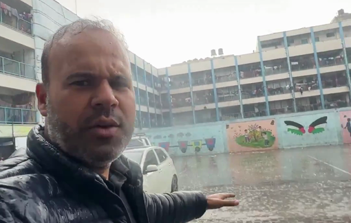 Thumbnail preview image for the video titled: Displaced people line up at charity kitchen despite heavy rain and bitter cold