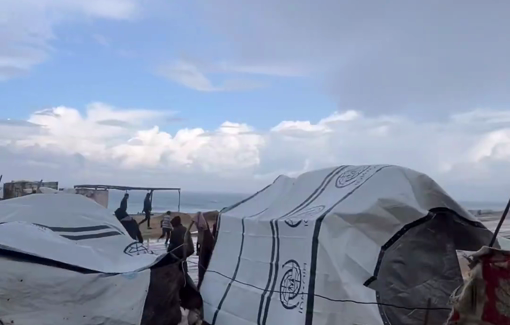 Thumbnail preview image for the video titled: Braving the storm to cover the tents with tarps