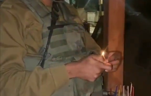 Thumbnail preview image for the video titled: Jewish soldiers celebrate Hanukkah by lighting candles during their raid in Nur Shams