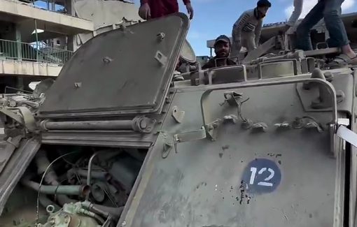 Thumbnail preview image for the video titled: Children extract fuel from abadoned Israeli APCs in Rafah