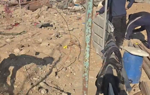 Thumbnail preview image for the video titled: An injured man with an amputated foot works to set up a tent on the rubble of his destroyed home in Jabalia camp