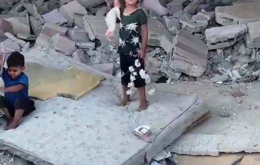 Thumbnail preview image for the video titled: A little Palestinian child playing over the rubble of her home