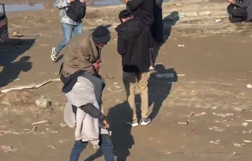 Thumbnail preview image for the video titled: Young man carries his elderly father on his shoulders during the return journey to northern Gaza