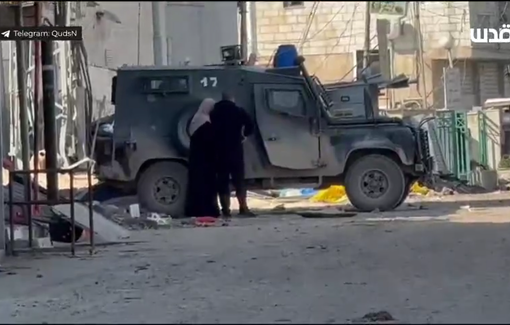 Thumbnail preview image for the video titled: A sick woman faints in front of the hospital after being prevented from reaching it by Israeli soldiers