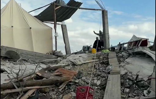 Thumbnail preview image for the video titled: Steadfast family sheltering atop the rubble of their home