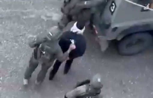 Thumbnail preview image for the video titled: Israeli soldiers detain a Palestinian youth after raiding a building in the city of Nablus