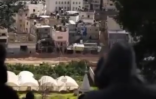 Thumbnail preview image for the video titled: Displaced Palestinians watch their homes being knocked down by Israeli in Nur Shams RC