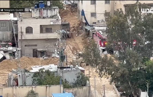 Thumbnail preview image for the video titled: Israeli Caterpillar 349 armored excavator destroying buildings in the Nur Shams Camp