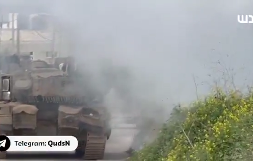 Thumbnail preview image for the video titled: An Israeli tank launches smoke shells targeting Palestinian lands during their hostile raid on the village of Burqin