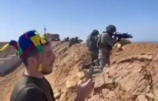 Thumbnail preview image for the video titled: IDF soldiers open fire at the mention of Haman during Purim reading