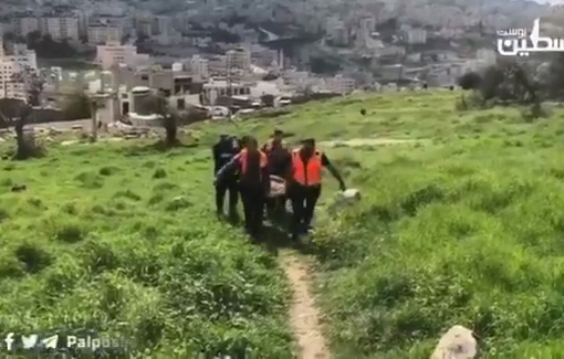 Thumbnail preview image for the video titled: Medical crews transferring a woman in poor health on foot from Al-Ain after an evacuation order issued by the IDF