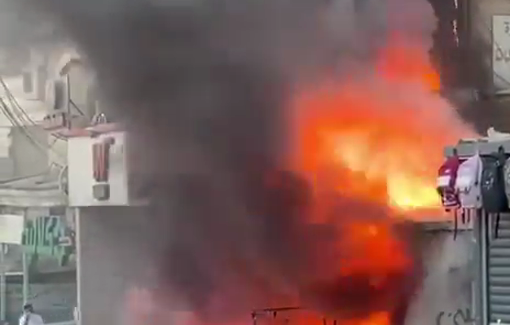 Thumbnail preview image for the video titled: IDF soldiers set fire to Palestinian store in occupied East Jerusalem