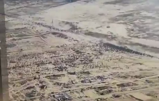 Thumbnail preview image for the video titled: Drone footage shows hundreds of Palestinians running towards a GHF aid site