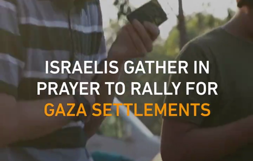 Thumbnail preview image for the video titled: Group prayer at Gaza border for settlement