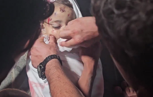 Thumbnail preview image for the video titled: Bereaved father cleans his baby daughter's face